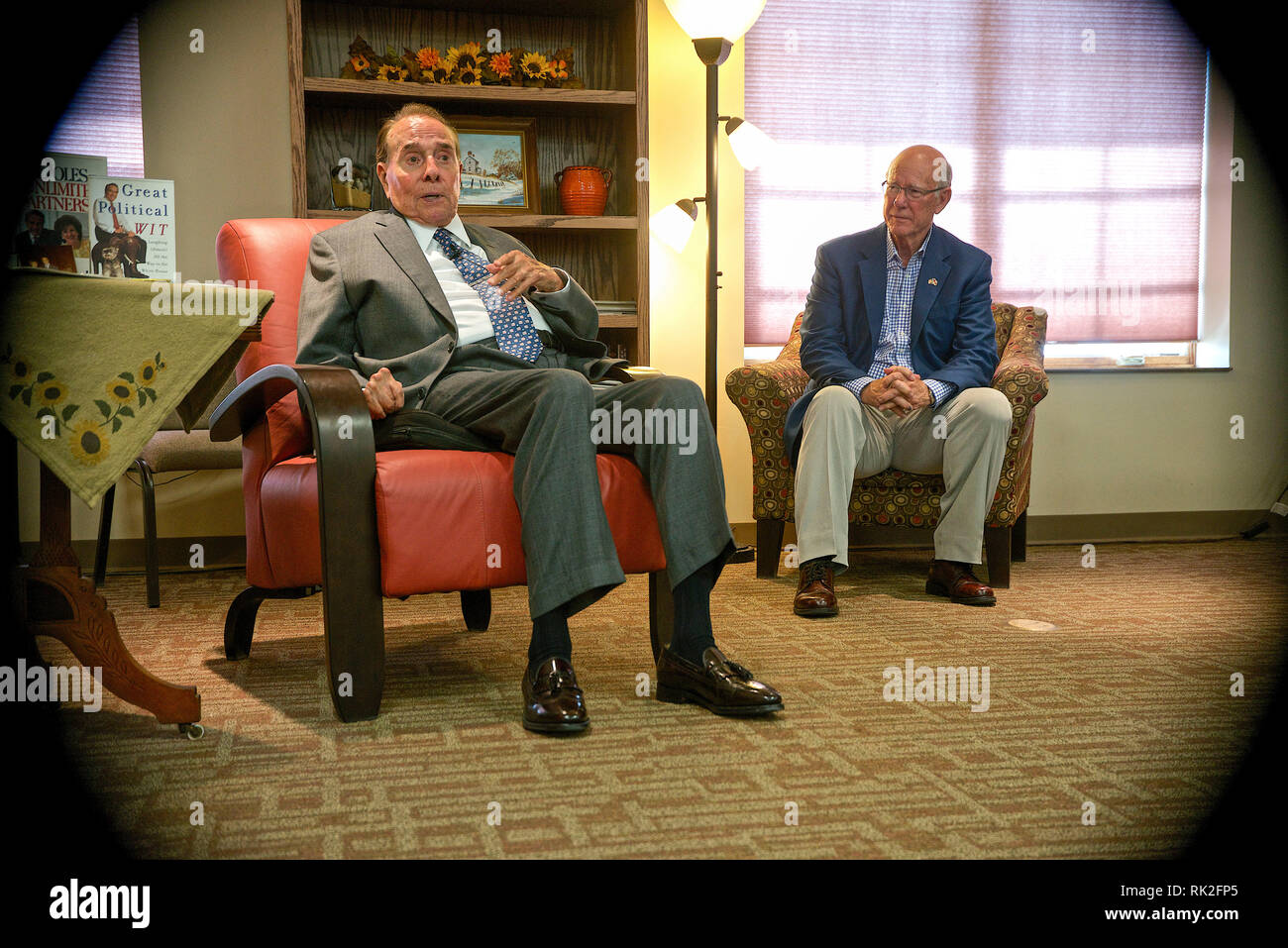 Greensburg, Kansas, USA,September 23, 2014 Former Senator Robert Dole visits with supporters at the Greensburg Senior Center, while Sen. Pat Roberts sits along side of him. Greensburg was destroyed by an F5 tornado in 2007 and now has been rebuilt with massive amount of help from FEMA. Stock Photo