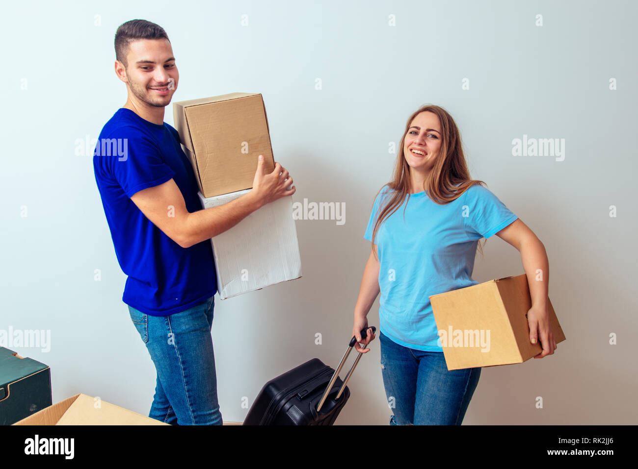 Young happy couple moving to a new home with cardboard boxes Stock ...
