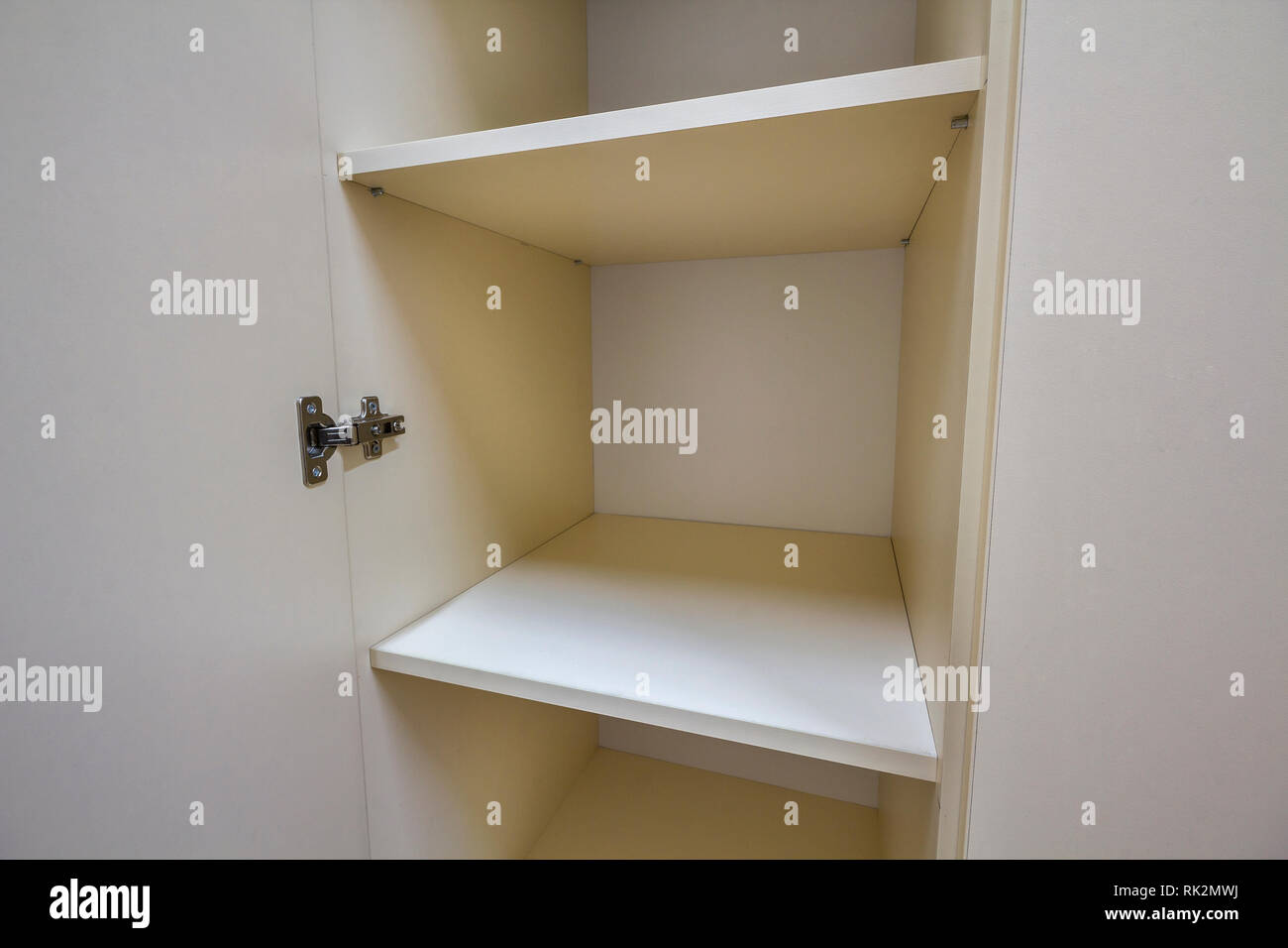 Interior Of White Plastic Cabinet Or Clothing Wardrobe With Many