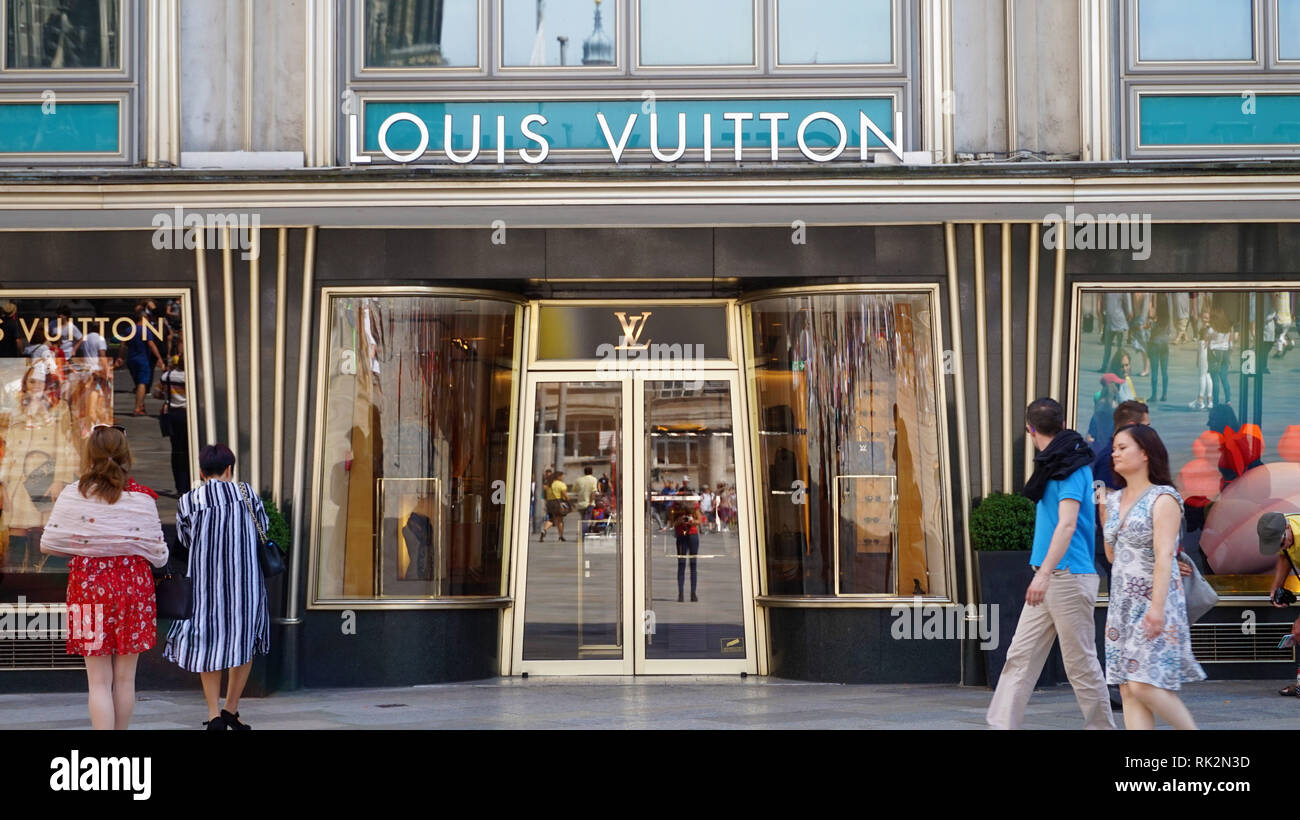 COLOGNE, GERMANY - MAY 31, 2018: Facade of Louis Vuitton store with tourists, Cologne, Germany Stock Photo
