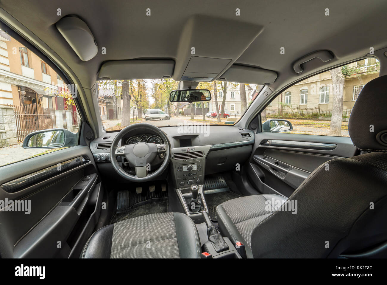 Luxurious car interior. Dashboard, steering wheel, gearshift and ...