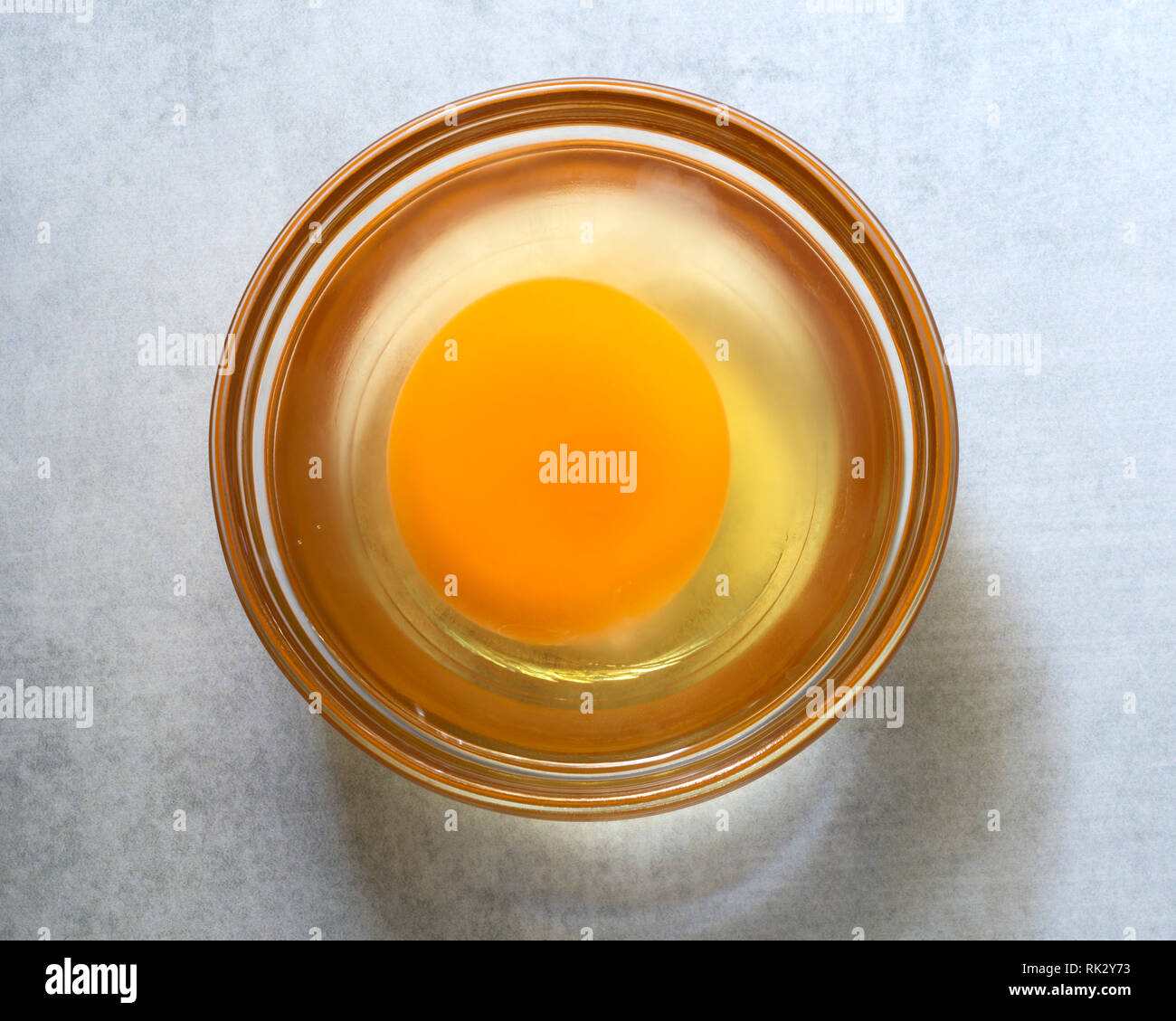 A cracked raw egg close-up. Stock Photo