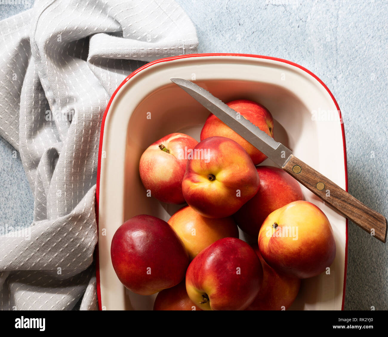 Red and yellow nectarines in a dish Stock Photo Alamy
