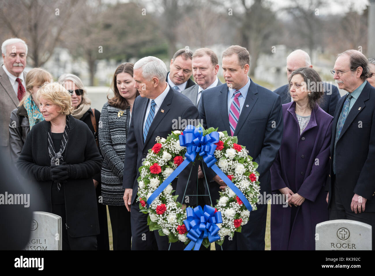 Vice President Mike Pence (center left) and NASA Administrator Jim Bridenstine (center right) participate in a wreath-laying ceremony at the graves of Apollo 1 crew members, U.S. Air Force Lt. Col. Virgil Grissom and U.S. Navy Lt. Cmdr. Roger Chaffee, during the NASA Day of Remembrance at Arlington National Cemetery, Arlington, Virginia, Feb. 7, 2019. Also present for the wreath-laying were family and friends of those who died in the Challenger and Columbia accidents, as well as several astronauts and former NASA Administrators. This annual event pays tribute “to the crews of Apollo 1 and spac Stock Photo
