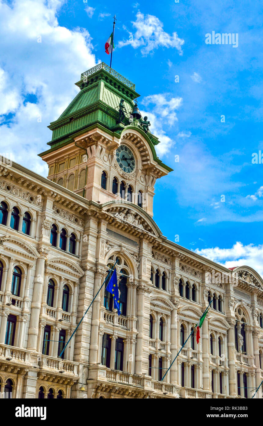 Municipio clock tower building of Trieste in Piazza Unita Italia Italy vertical landmark background Stock Photo
