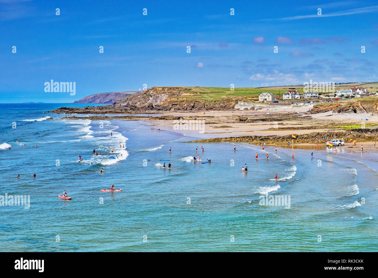 6 July 2018: Bude, Cornwall, UK - Crowds cooling off in the sea during the summer heatwave. Stock Photo