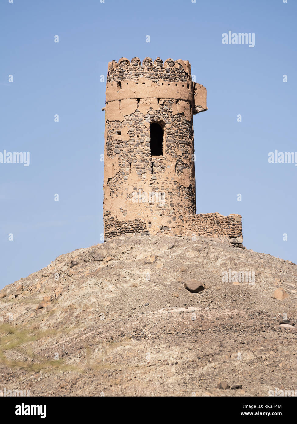 Ancient tower on top of a rocky hill in Oman Stock Photo