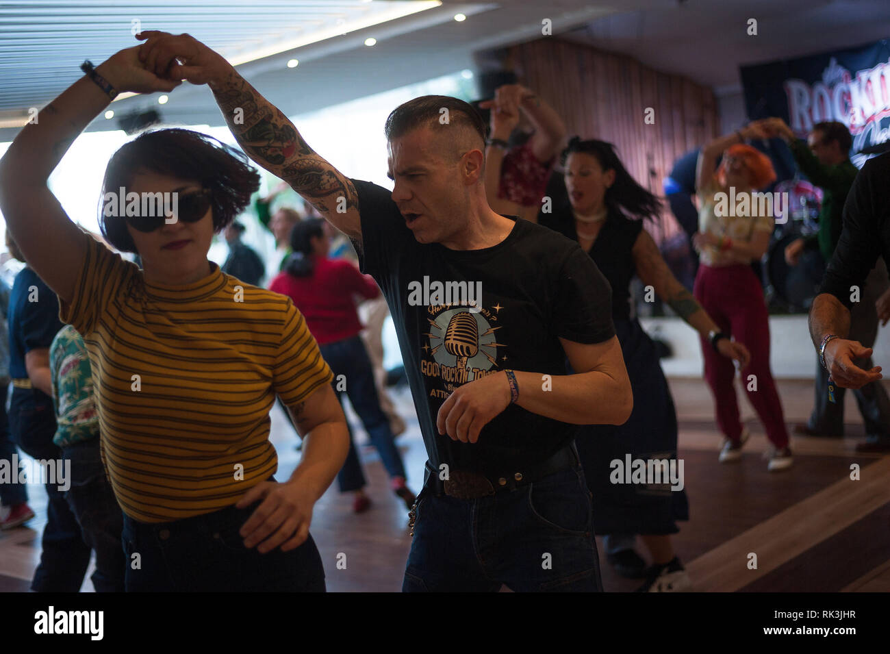 A couple are seen dancing during the Rockin Race Jamboree Festival. Thousands of people from around the world gather every year during The Rockin' Race Jamboree International Festival for four days in Torremolinos, a meeting place for all lovers of rockabilly and swing music Stock Photo