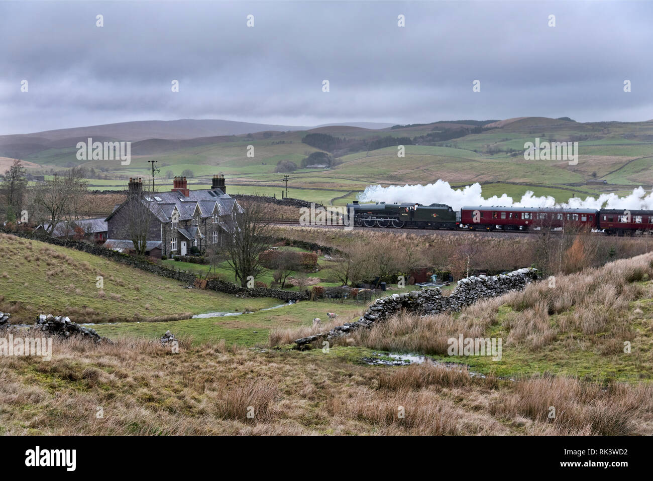 Ribblesdale, North Yorkshire, UK. 9th Feb 2019. Newly restored steam locomotive 'Bahamas' 45596 returns to mainline rail duties. In blustery Pennine weather, the train is seen here at Selside, Ribblesdale on the Settle-Carlisle railway line in the Yorkshire Dales National Park. The loco was hauling the 'Bahamas Railtour 1' on a return trip to Carlisle from its base at Oxenhope on the Keighley and Worth Valley Railway. Credit: John Bentley/Alamy Live News Stock Photo