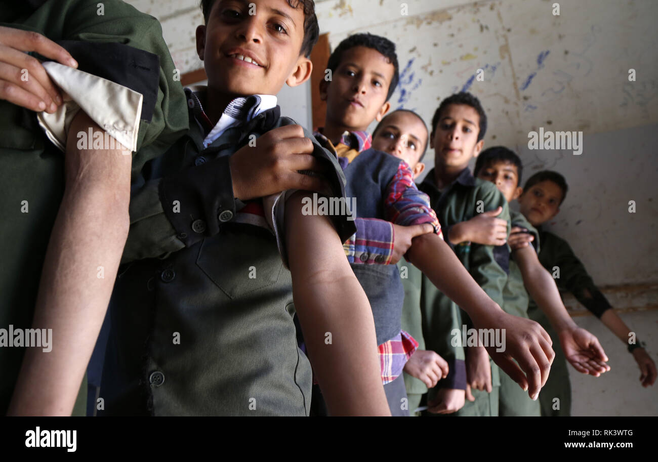 Sanaa, Yemen. 9th Feb, 2019. Yemeni students prepare to receive anti-measles and rubella vaccine in a school in Sanaa, Yemen, on Feb. 9, 2019. A National Measles and Rubella Immunization Campaign kicked off on Saturday in Yemen and will last six days. The campaign targets Yemeni children from the age of six months to 15 years, according to the local media. Credit: Mohammed Mohammed/Xinhua/Alamy Live News Stock Photo