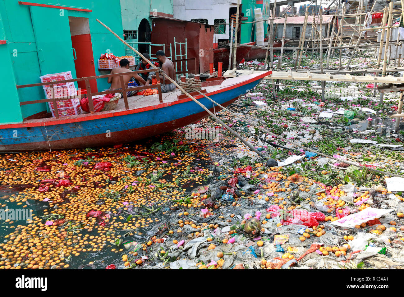 Dhaka, Bangladesh - February 09, 2019:  Industry, mills, factories, chemical waste, orange, plastic and garbage at the polluted Buriganga River in Dhaka, Bangladesh, Credit: SK Hasan Ali/Alamy Live News Stock Photo