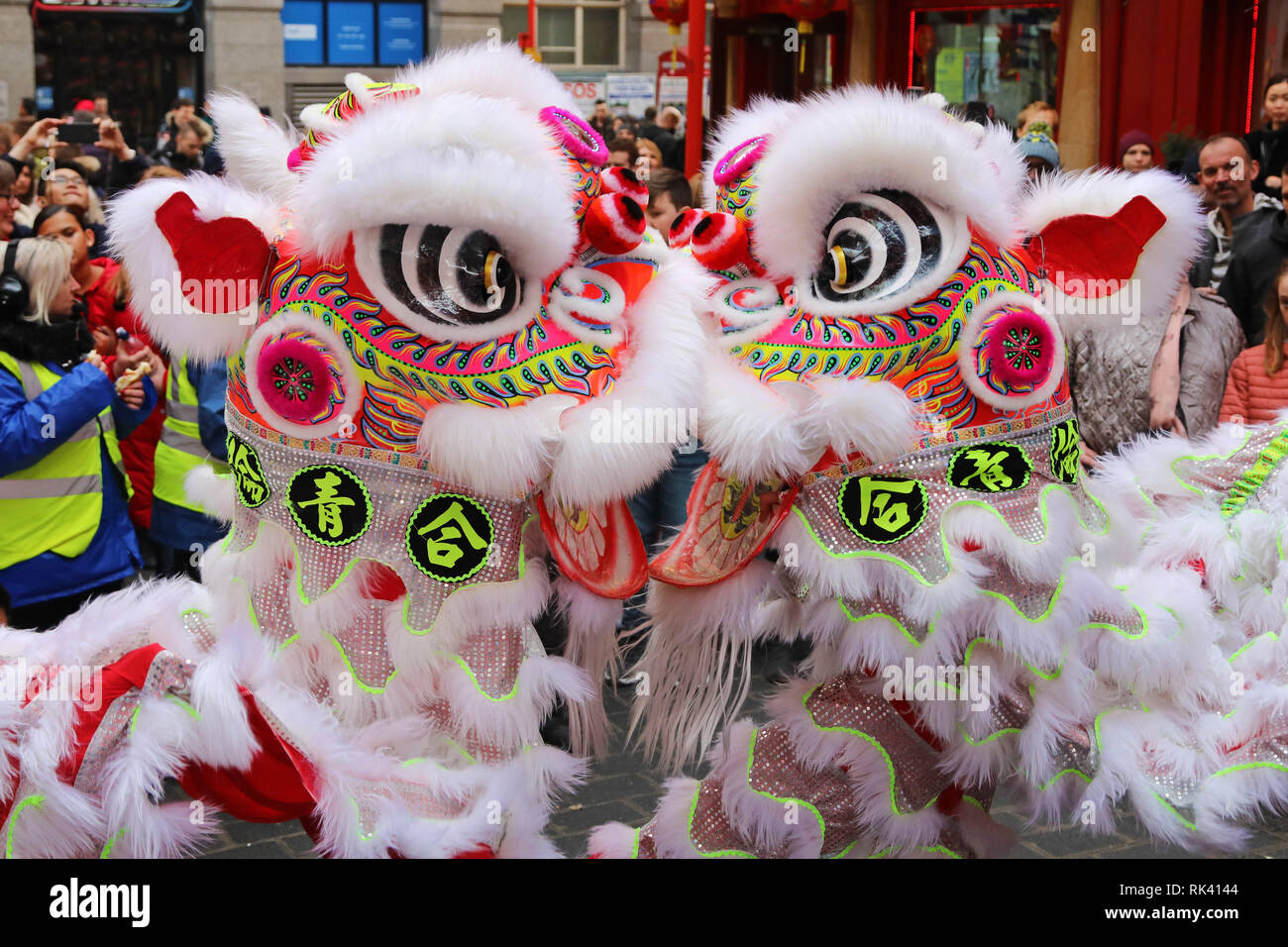 London, UK. 9th Feb, 2019. Crowds watching the Lion Dance in Gerrard Street in Chinatown as part of the Chinese New Year Celebrations for the year of the Pig in London Credit: Paul Brown/Alamy Live News Stock Photo
