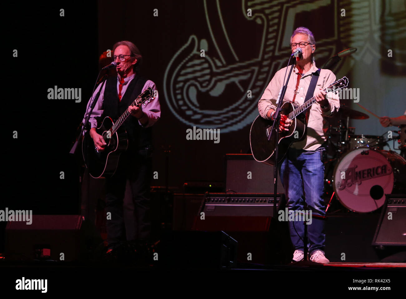 HUNTINGTON, NY - FEB 8: Dewey Bunnell (L) and Gerry Beckley of America perform in concert at the Paramount on Februay 8, 2019 in Huntington, New York. Stock Photo