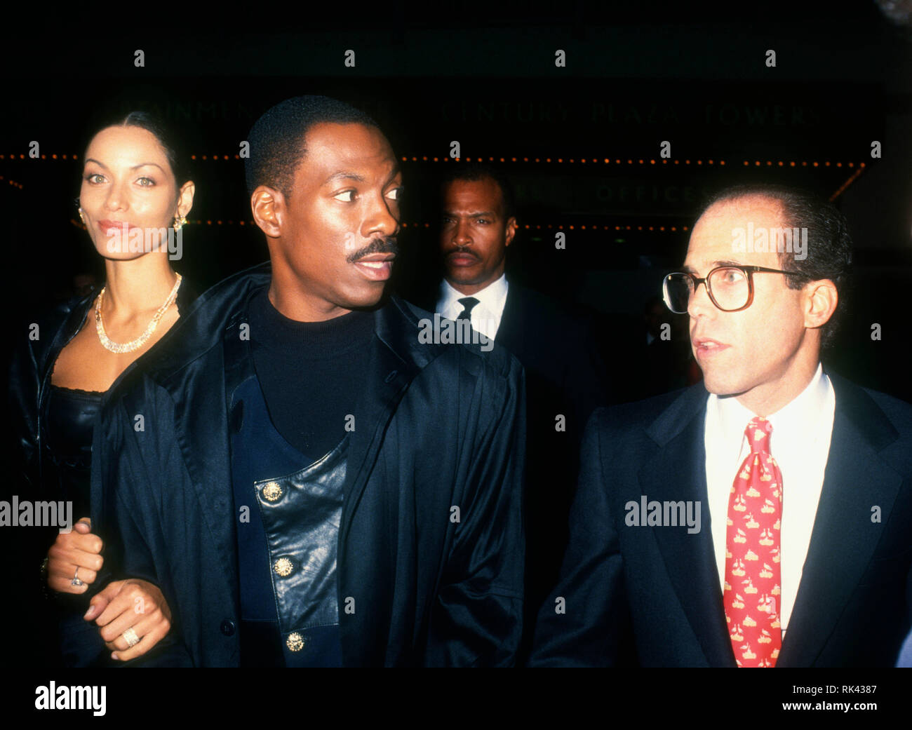 CENTURY CITY, CA - DECEMBER 14: Actor Eddie Murphy and model wife Nicole Mitchell Murphy and producer Jeffrey Katzenberg attend TriStar Pictures' 'Philadelphia' Premiere on December 14, 1993 at Cineplex Odeon Century Plaza Cinemas in Century City, California. Photo by Barry King/Alamy Stock Photo Stock Photo