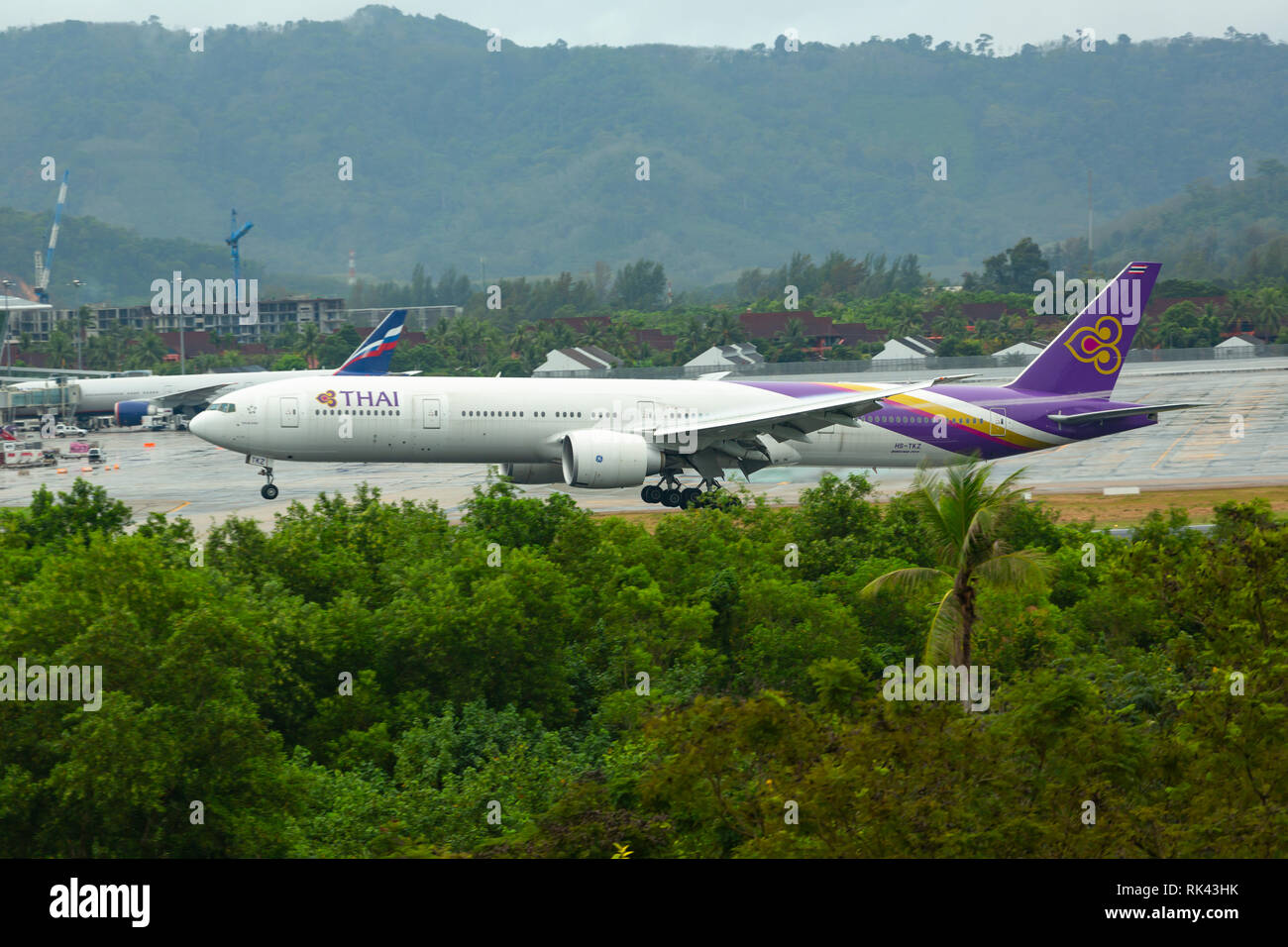 Boeing 777 Thai Airways lands Stock Photo - Alamy