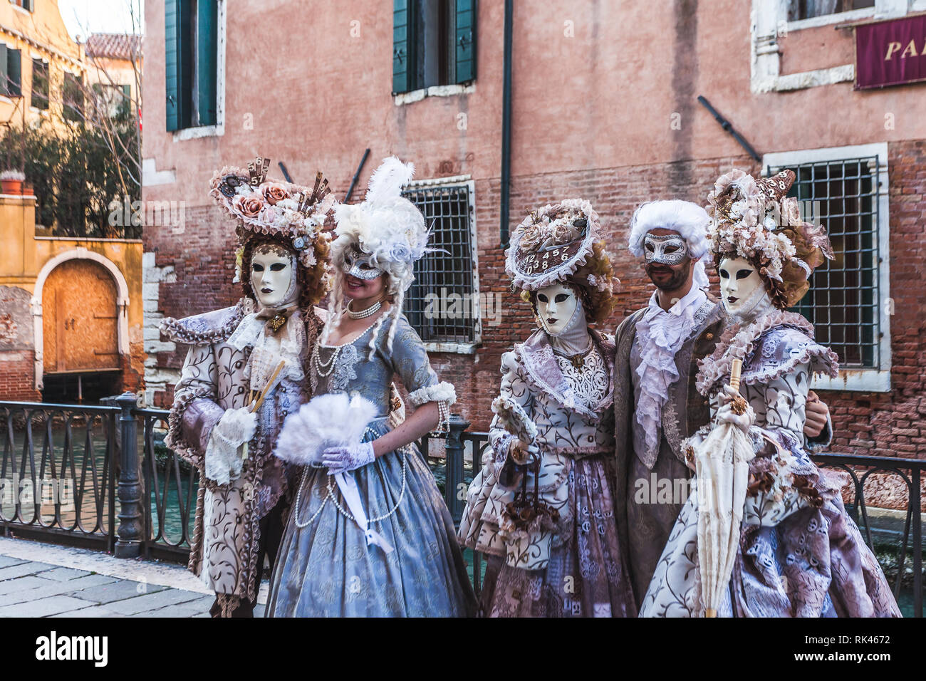 VENICE, ITALY - FEBRUARY 10 2018: Five hundred dressed carnival masks posing for photographers Stock Photo