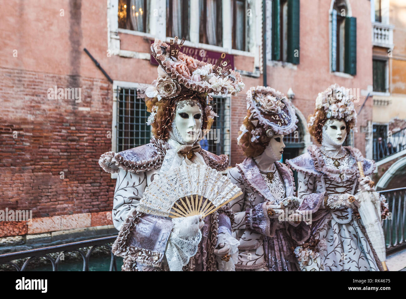 VENICE, ITALY - FEBRUARY 10 2018: Five hundred - dressed carnival masks posing for photographers Stock Photo