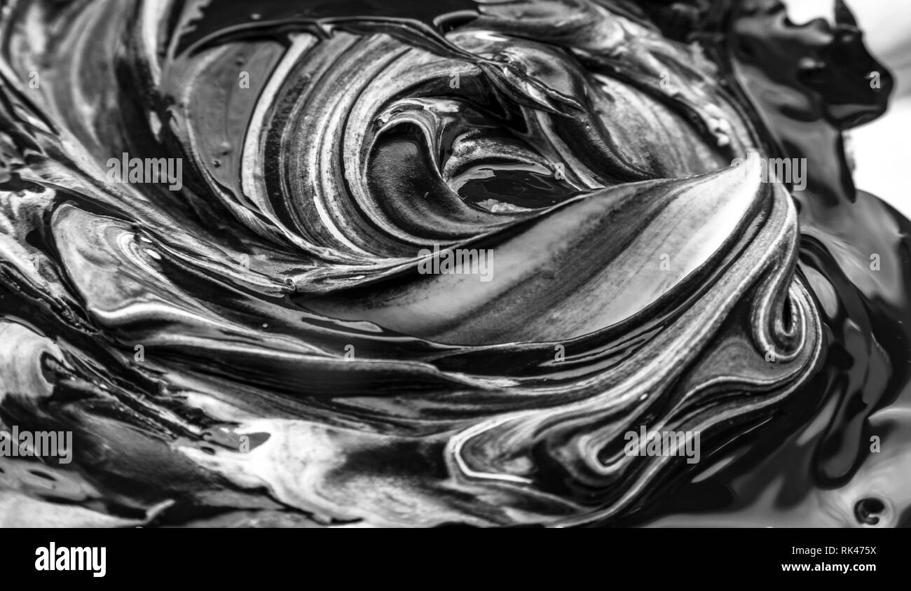 Abstract black and white artwork as a result of mixing paint Stock Photo