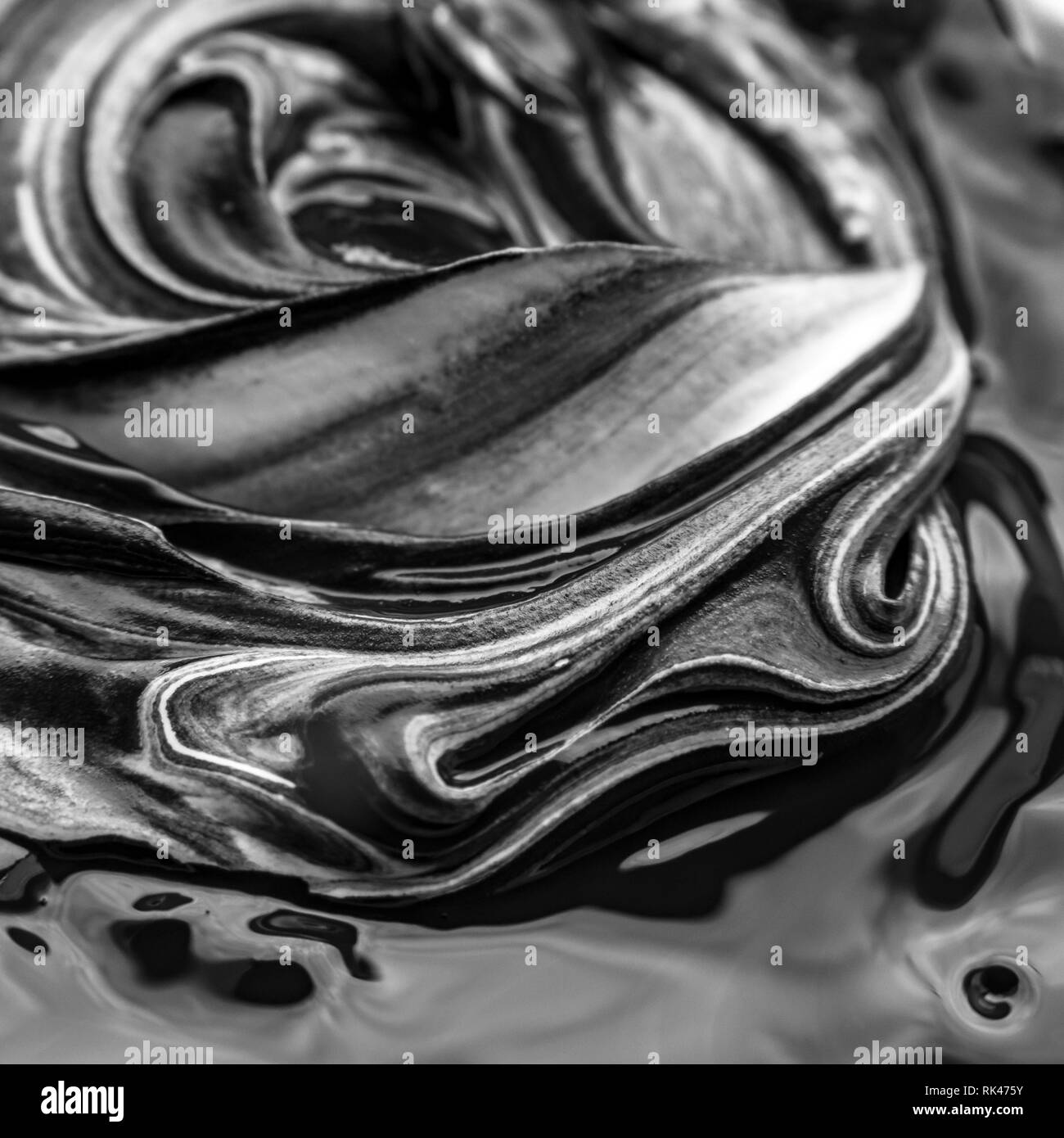 Abstract black and white artwork as a result of mixing paint Stock Photo Alamy