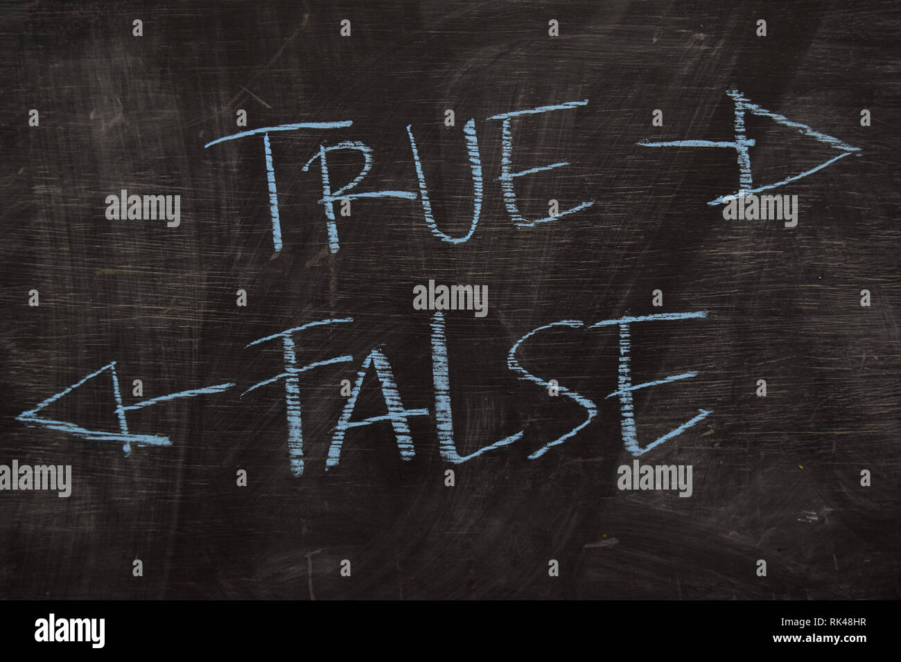 True or False written with color chalk concept on the blackboard Stock Photo