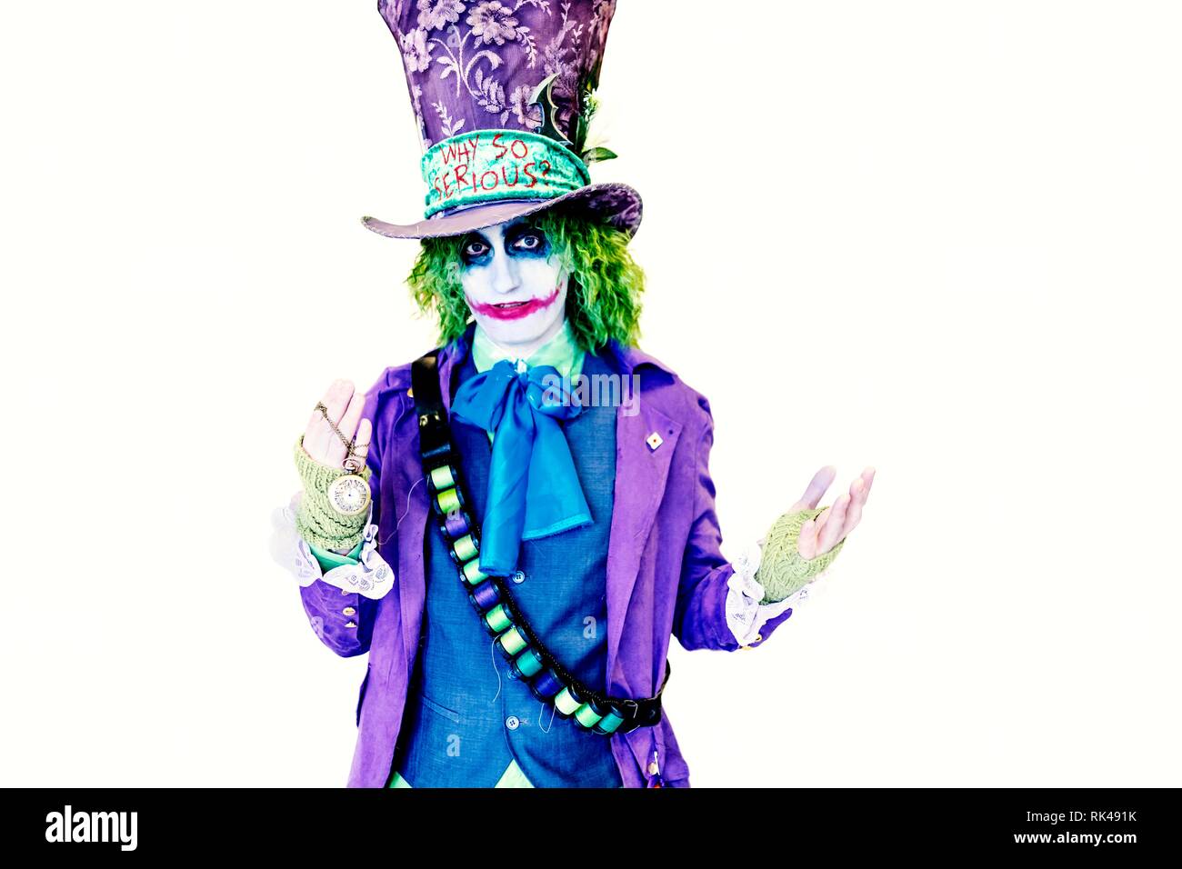 Birmingham, UK - March 17, 2018. A cosplayer dressed as DC Comics, The Joker,  wearing a mad hatters costume with the slogan, why so serious, at a comi  Stock Photo - Alamy
