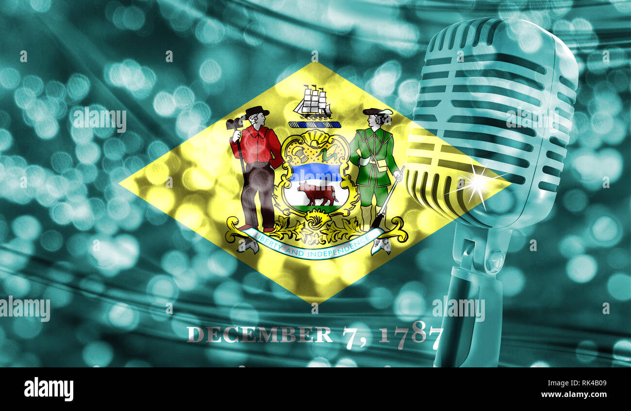 Microphone on a background of a blurry State of Delaware flag close-up Stock Photo