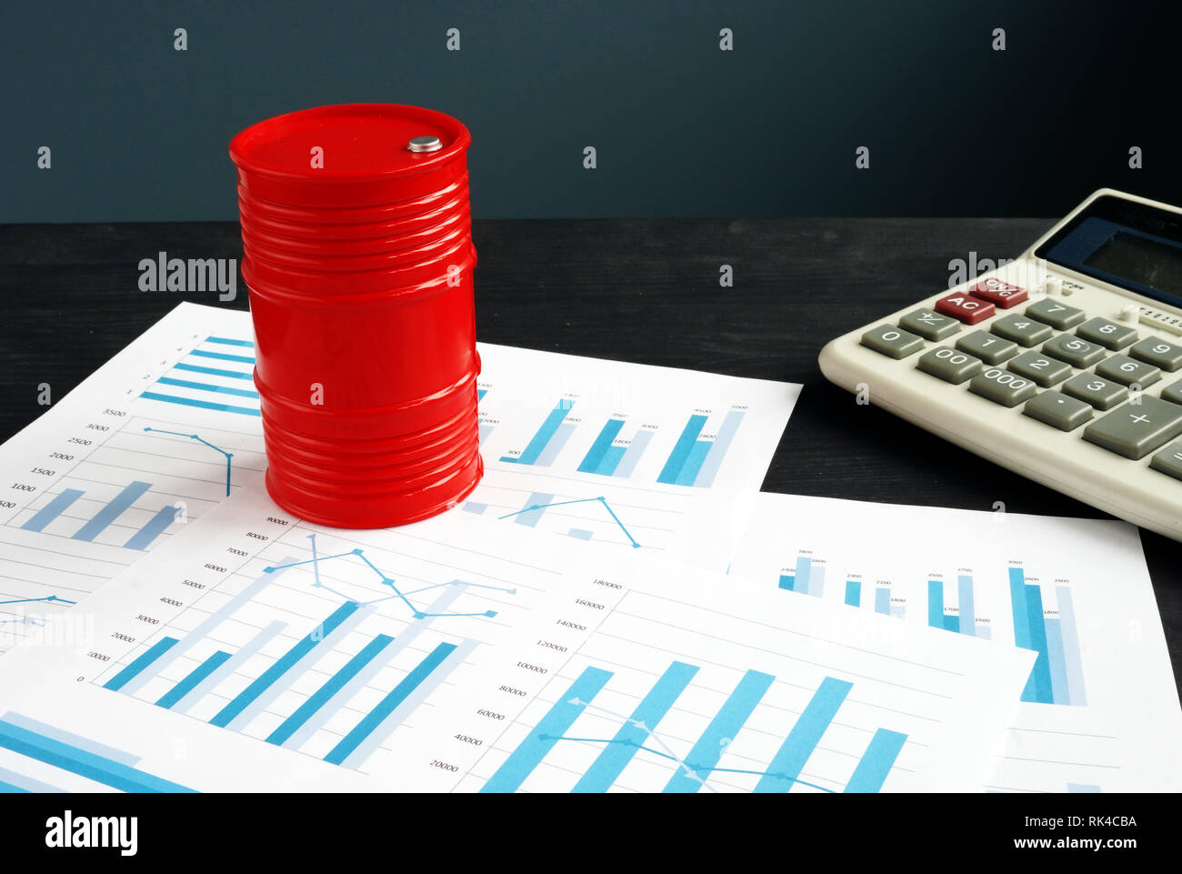 Oil trading concept. Barrel and exchange data with financial reports. Stock Photo