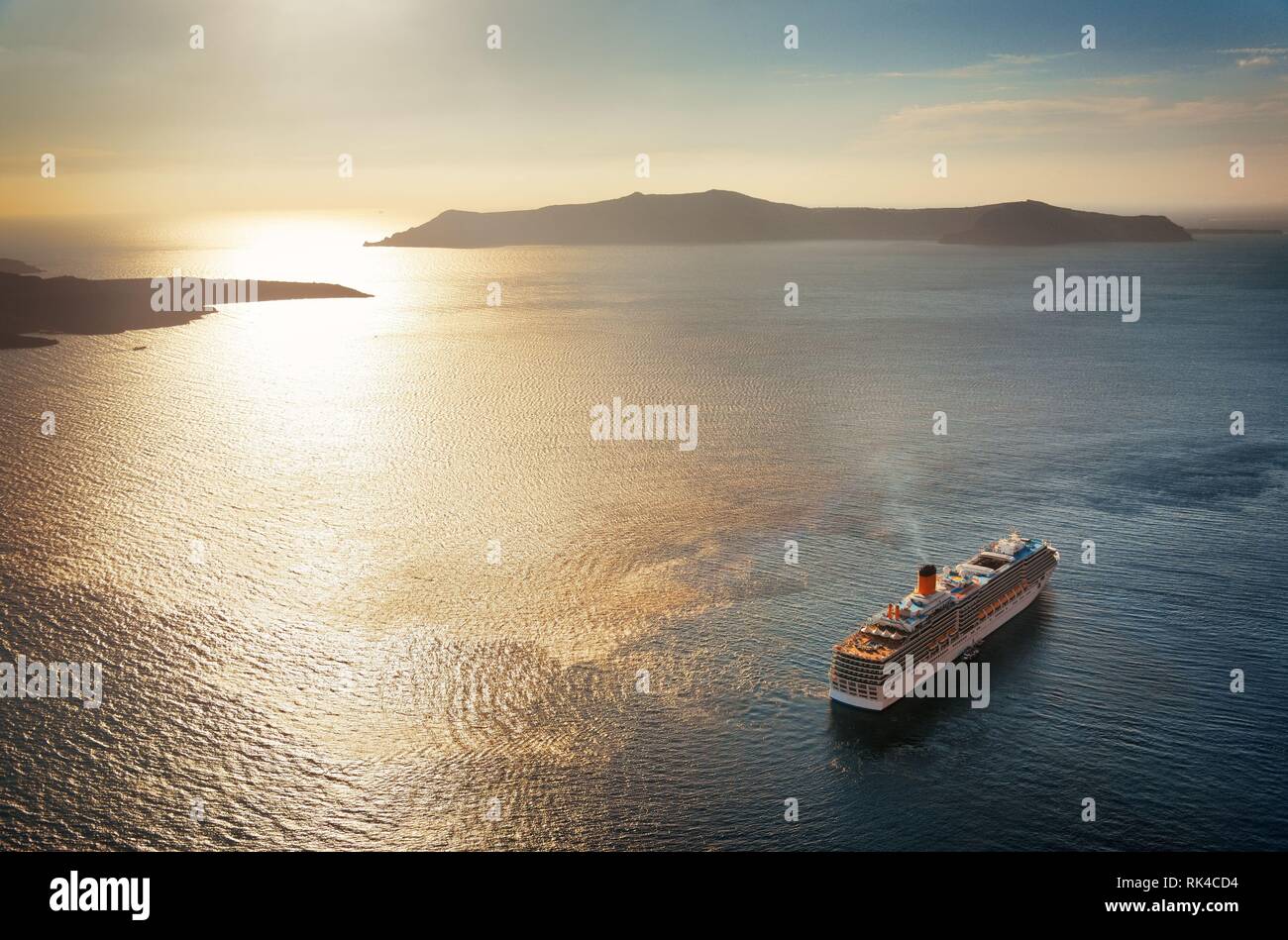 Santorini island with cruise ship at sunset in Greece Stock Photo - Alamy