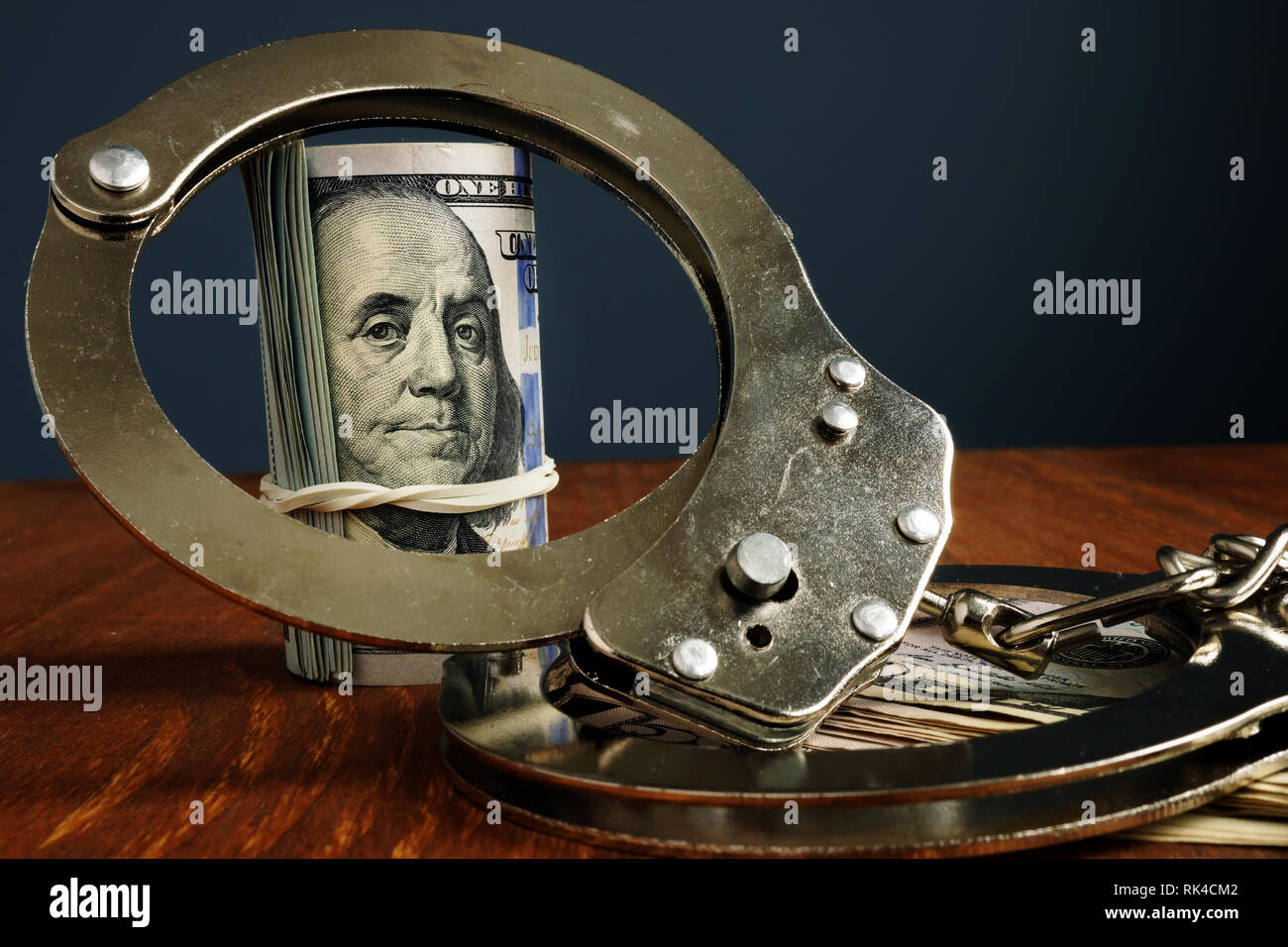 Penalty or bail bond concept. Money and handcuffs. Stock Photo
