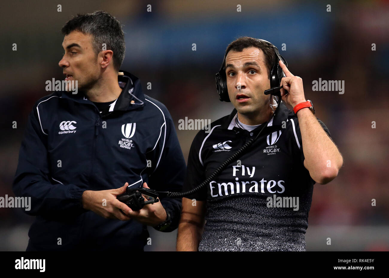 The match referee Mathieu Raynal speaks to the TMO (Television match official) to review a try decision during the Guinness Six Nations match at The Stadio Olimpico, Rome. Stock Photo