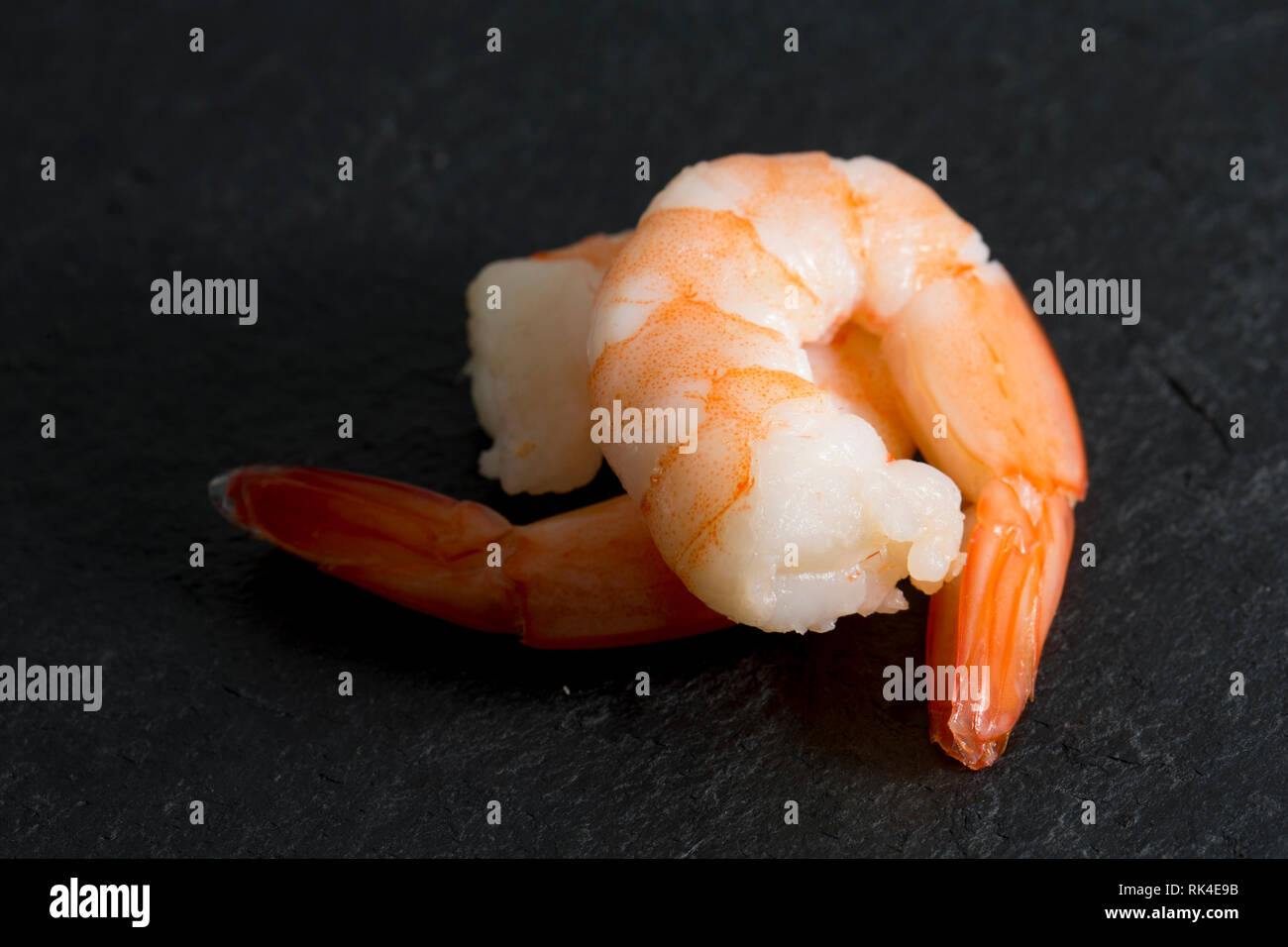 Farmed, cooked jumbo king prawns, Litopenaeus vannamei, bought from a
