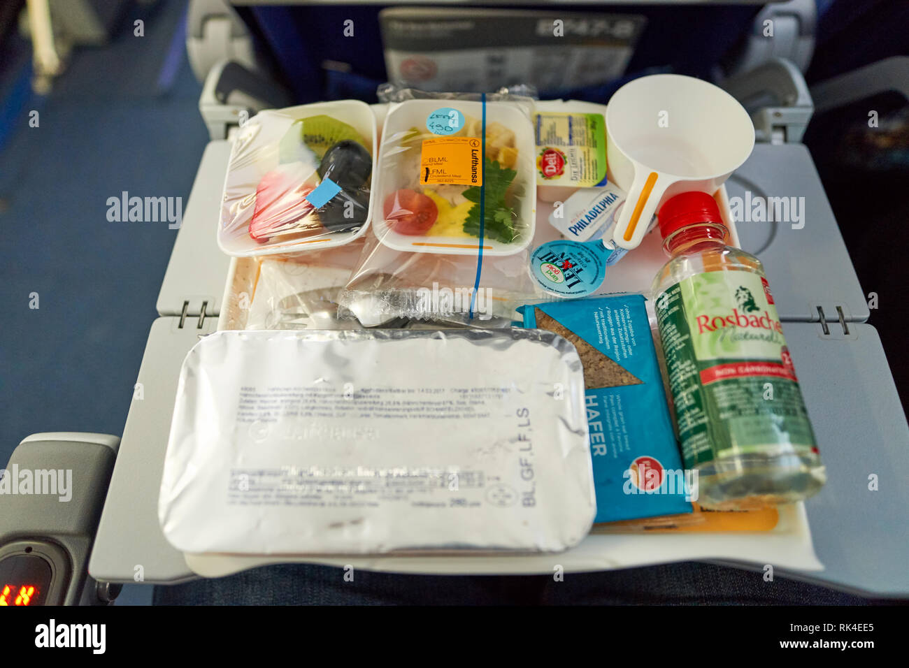FRANKFURT, GERMANY - MARCH 13, 2016: close up shot of meal at Lufthansa Boeing 747-8 economy class.  Deutsche Lufthansa AG, commonly known as Lufthans Stock Photo