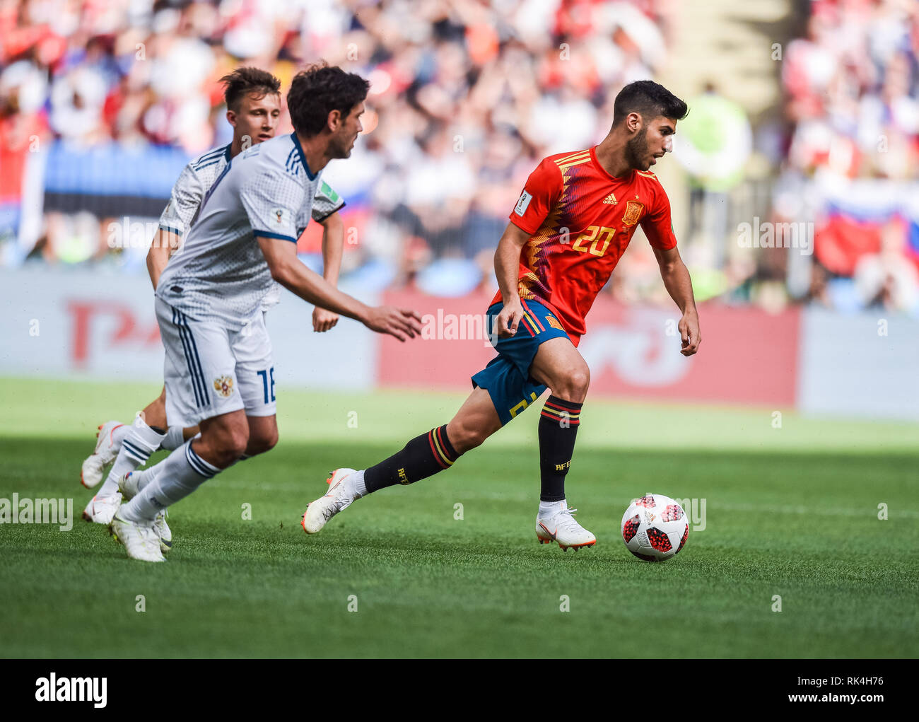 Moscow, Russia - July 1, 2018. Spain national football team midfielder Marco Asensio against Russian players Yury Zhirkov and Aleksandr Golovin during Stock Photo