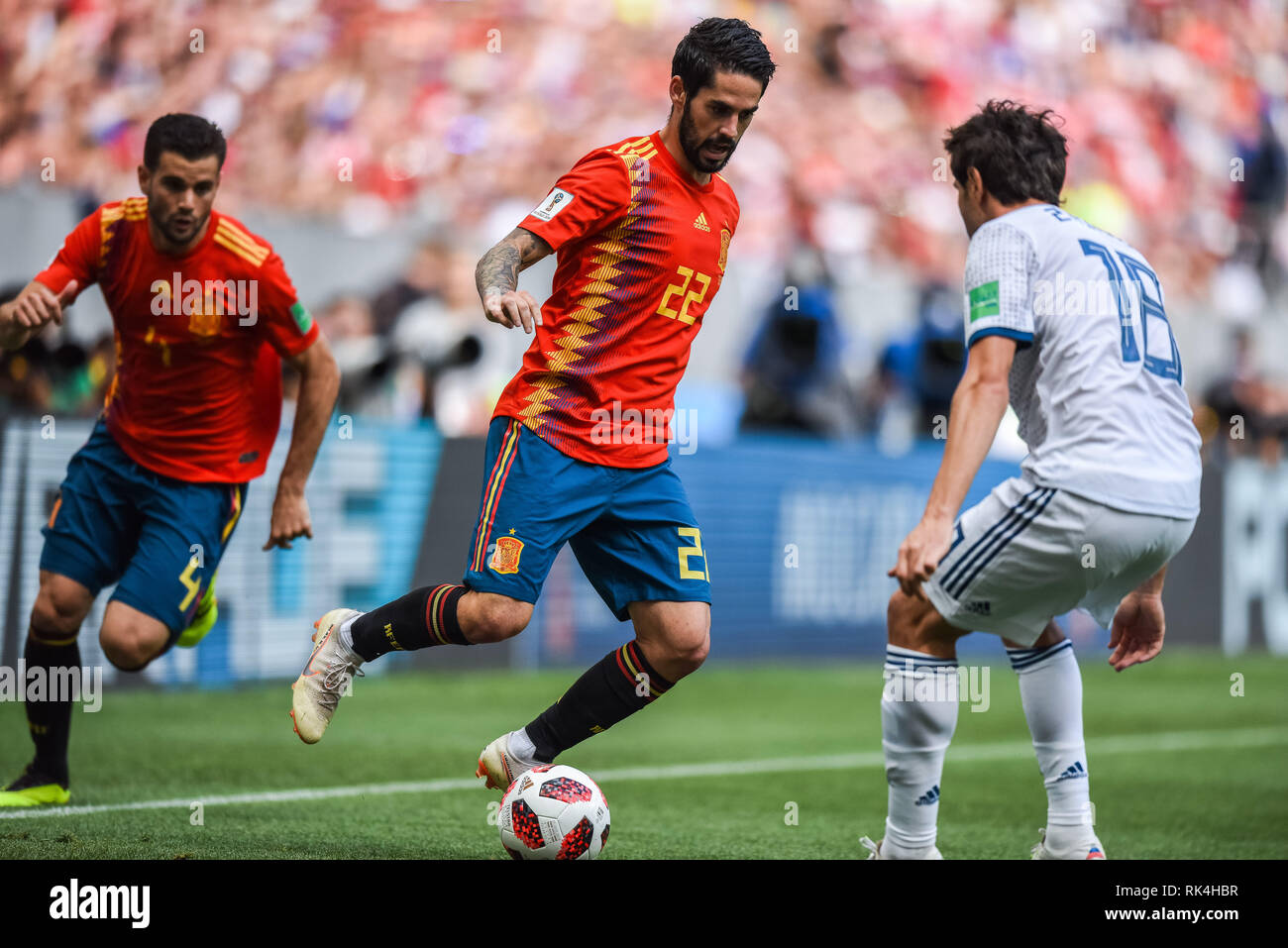 Moscow, Russia - July 1, 2018. Spain national football team midfielder Isco against Russia midfielder Yury Zhirkov during FIFA World Cup 2018 Round of Stock Photo