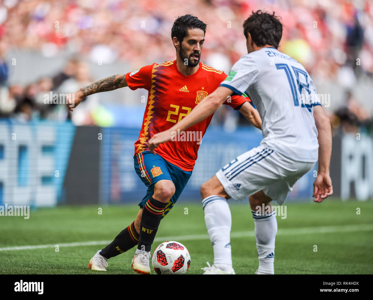 Moscow, Russia - July 1, 2018. Spain national football team midfielder Isco against Russia midfielder Yury Zhirkov during FIFA World Cup 2018 Round of Stock Photo