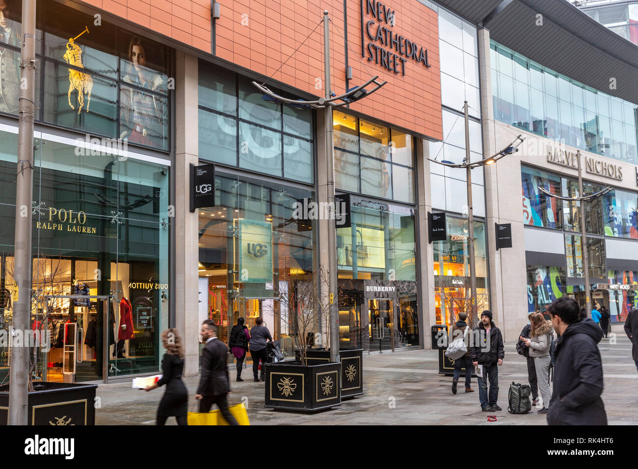 New Cathedral street in Manchester city centre with luxury goods retailers including Burberry,Ralph Lauren Polo and Harvey Nichols,England Stock Photo