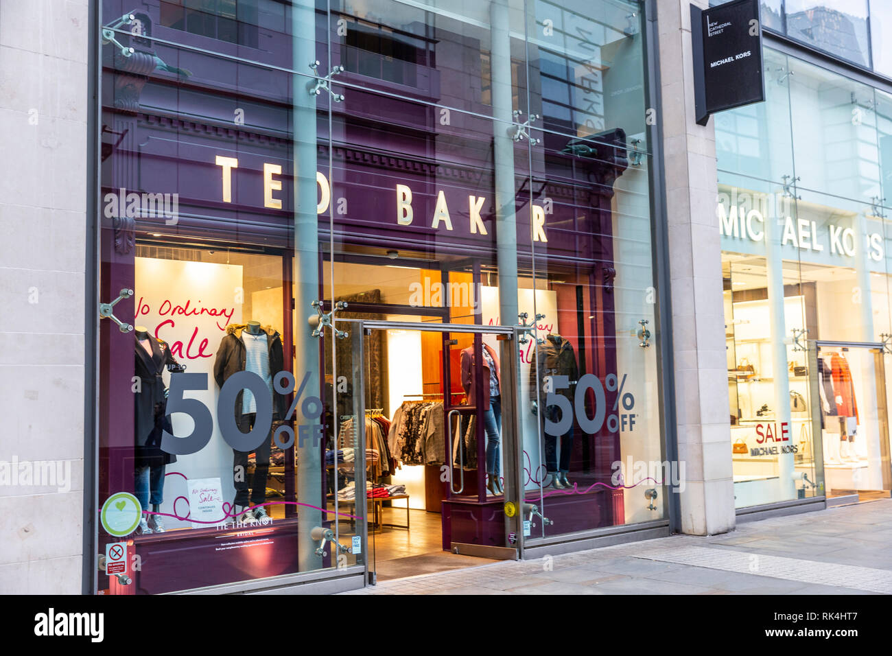 Ted Baker and Michael Kors stores and shopfronts in New Cathedral Street,Manchester city centre,England Stock Photo