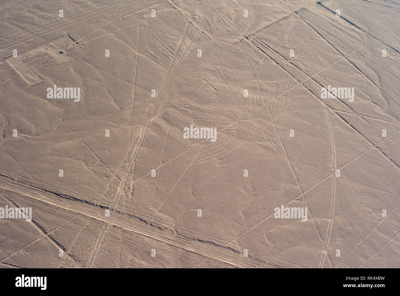Aerial photo of the Mysterious the Condor Geoglyph, Nazca Lines Unesco World Heritage Site, Peru Stock Photo