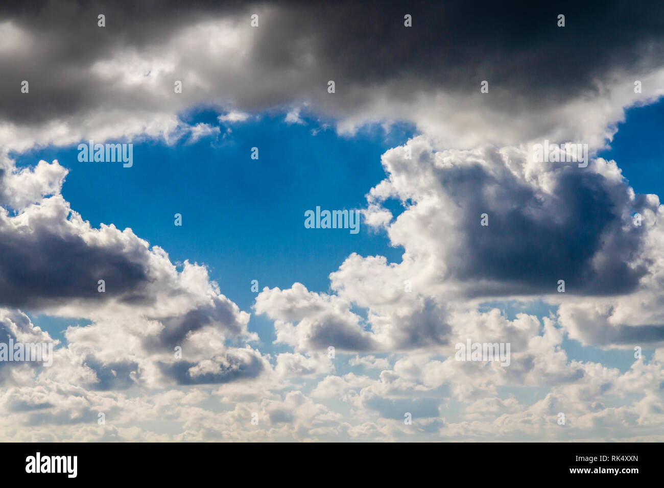 Dark clouds in a blue sky Stock Photo - Alamy