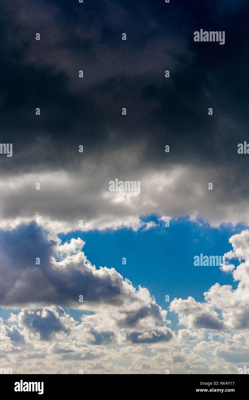 Dark clouds in a blue sky Stock Photo