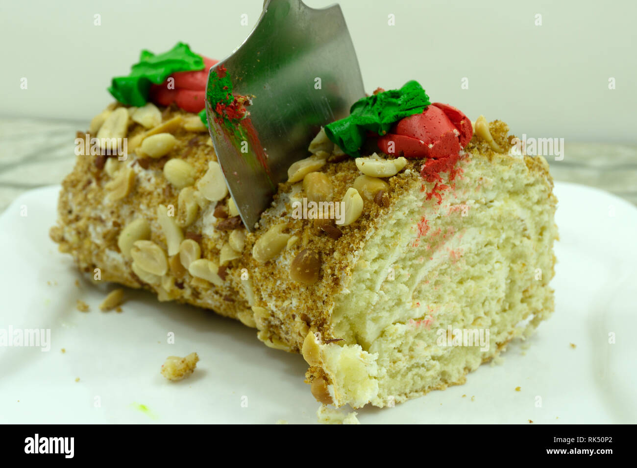 No bake chocolate roll cake filled with coconut cream and raspberry . Stock Photo