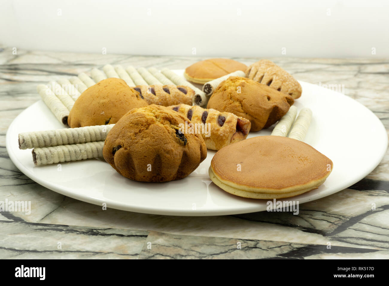 chocolate chips banana muffins on rustic background . Stock Photo