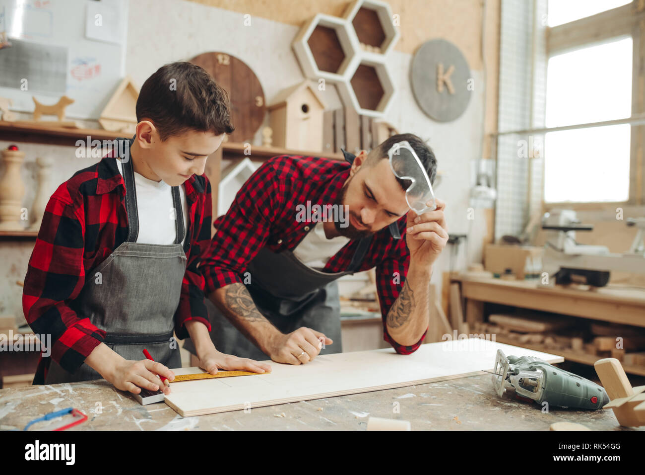 Curious little boy take classes of carpentery from famous woodworker ...
