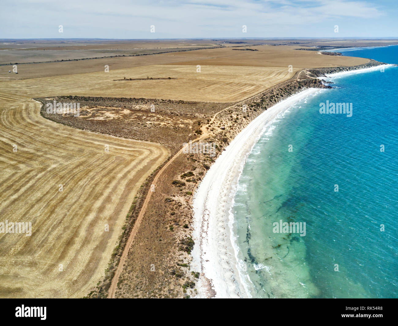 Aerial of the wheat farmland developed on the scenic coastal strip of land near the small coastal community of Port Neill Spencer Gulf Eyre Peninsula  Stock Photo