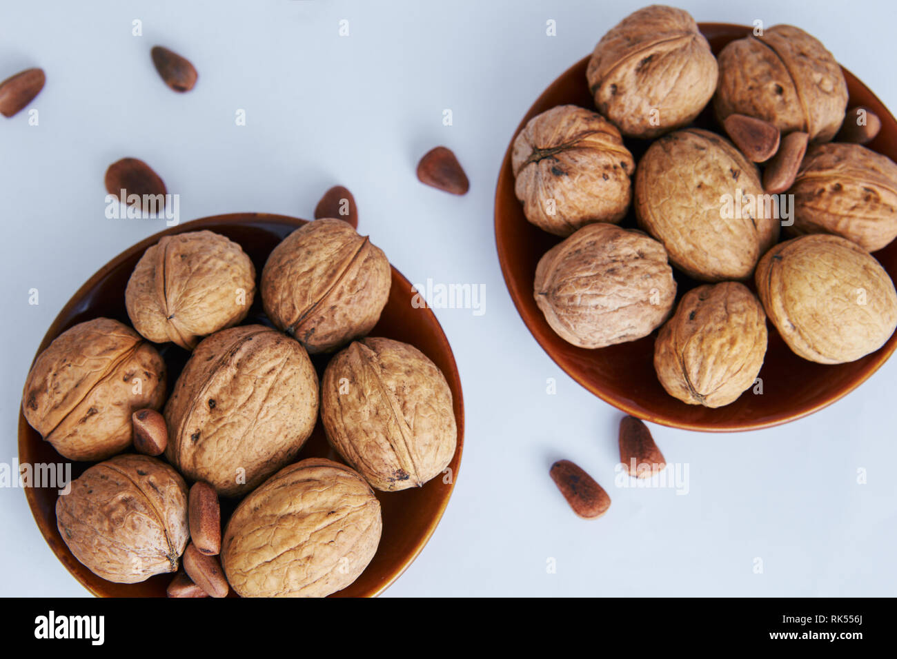Greek nuts on a white background, lying in a beautiful plate Stock