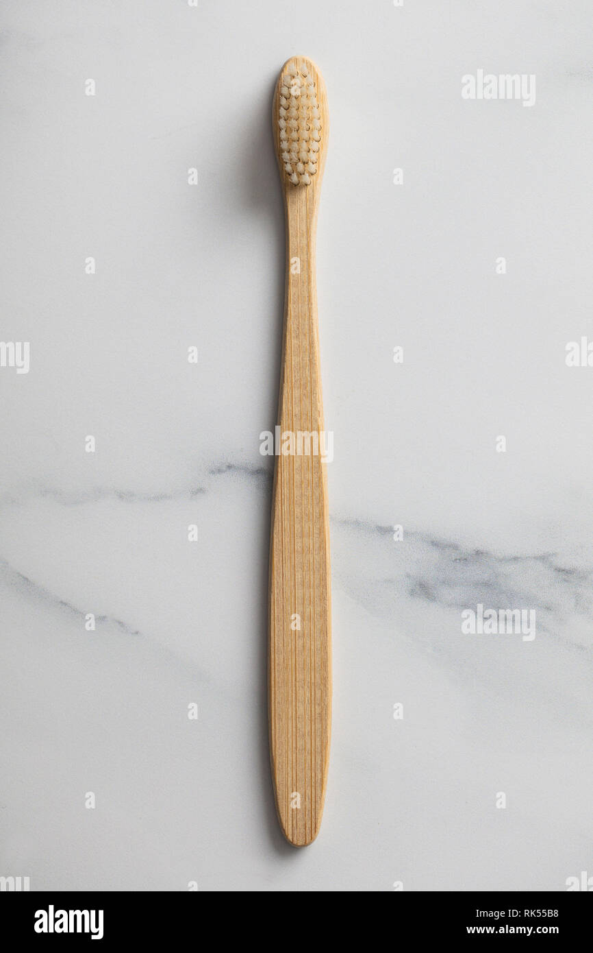 Wooden bamboo toothbrush on a marble background Stock Photo - Alamy