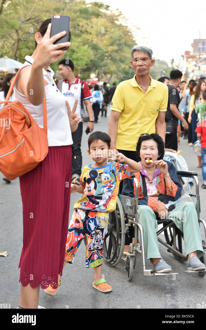 Thai family taking a selfie, Chiang Maii Stock Photo