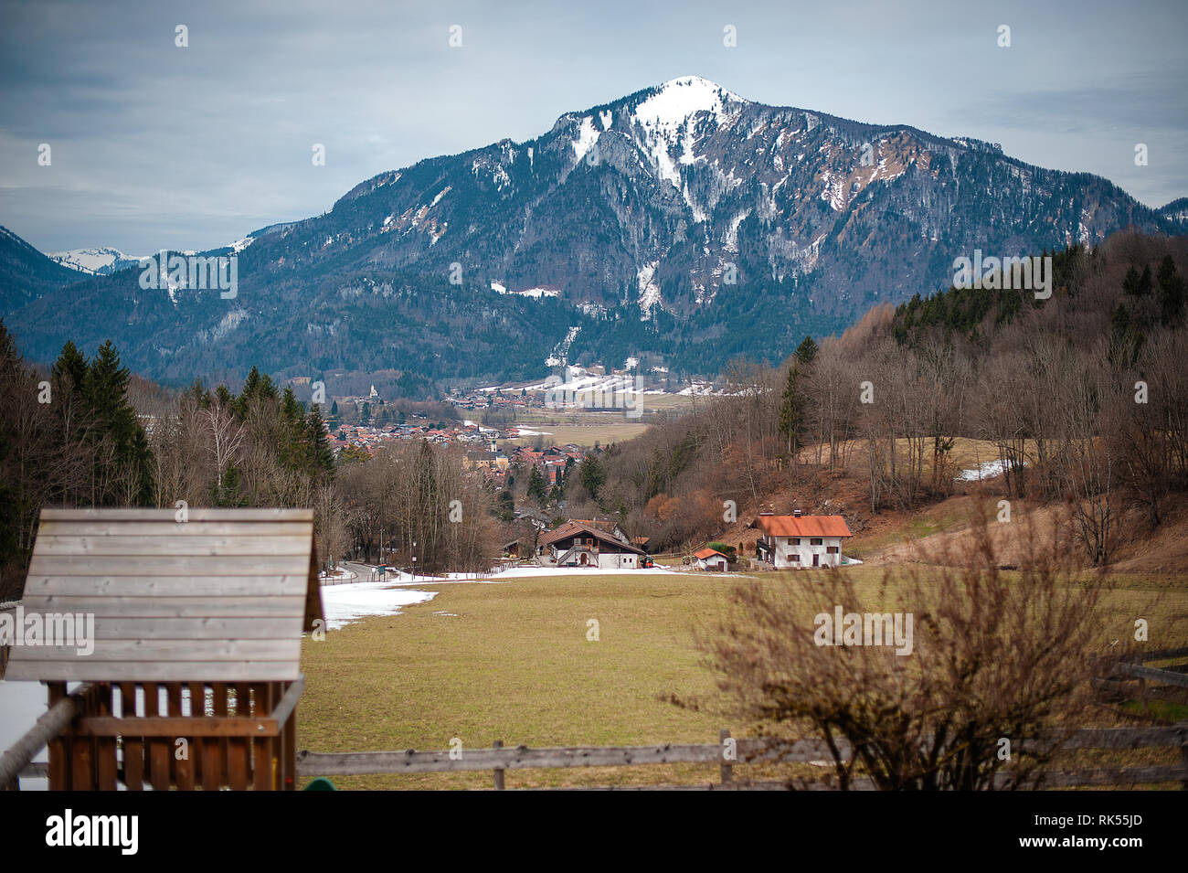 View of the Alps with lawn and houses in a small village Stock Photo ...