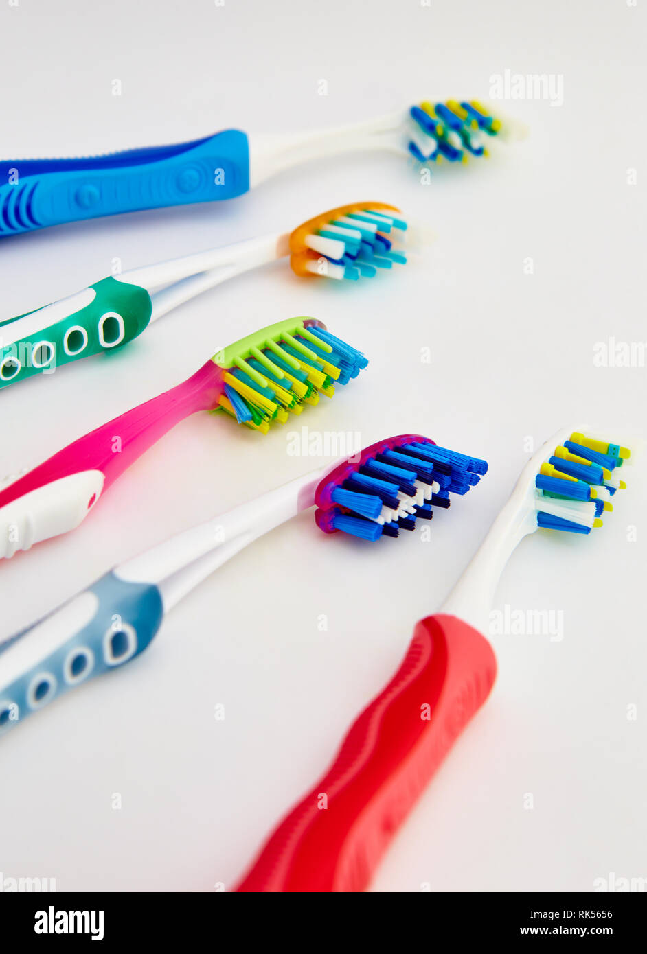 many toothbrushes on a white background Stock Photo Alamy