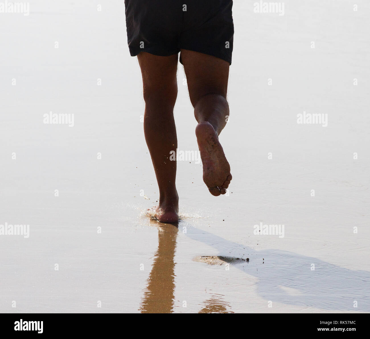 Male feet walking on sand hi-res stock photography and images - Alamy